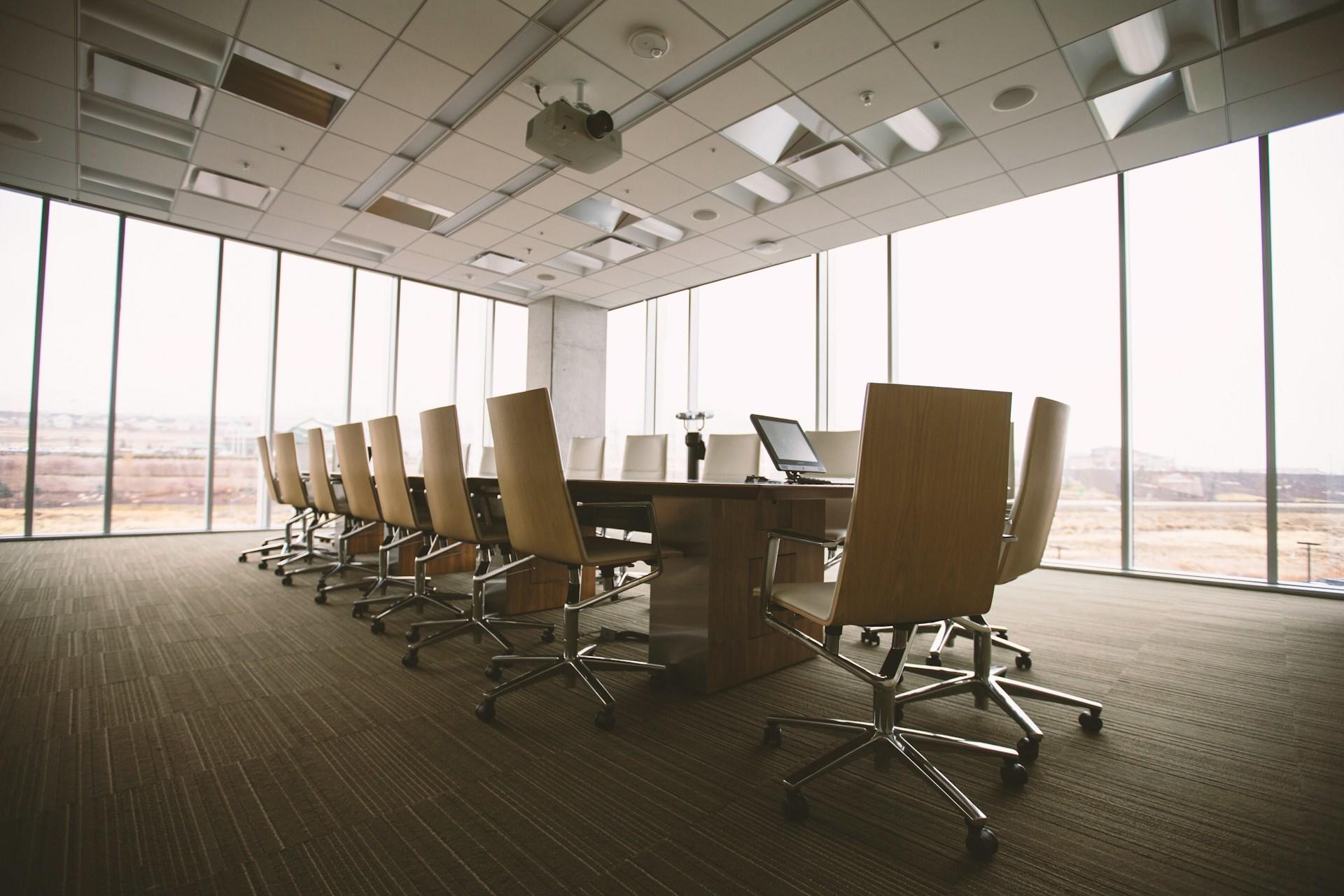 meeting room in an office with chairs and a desk