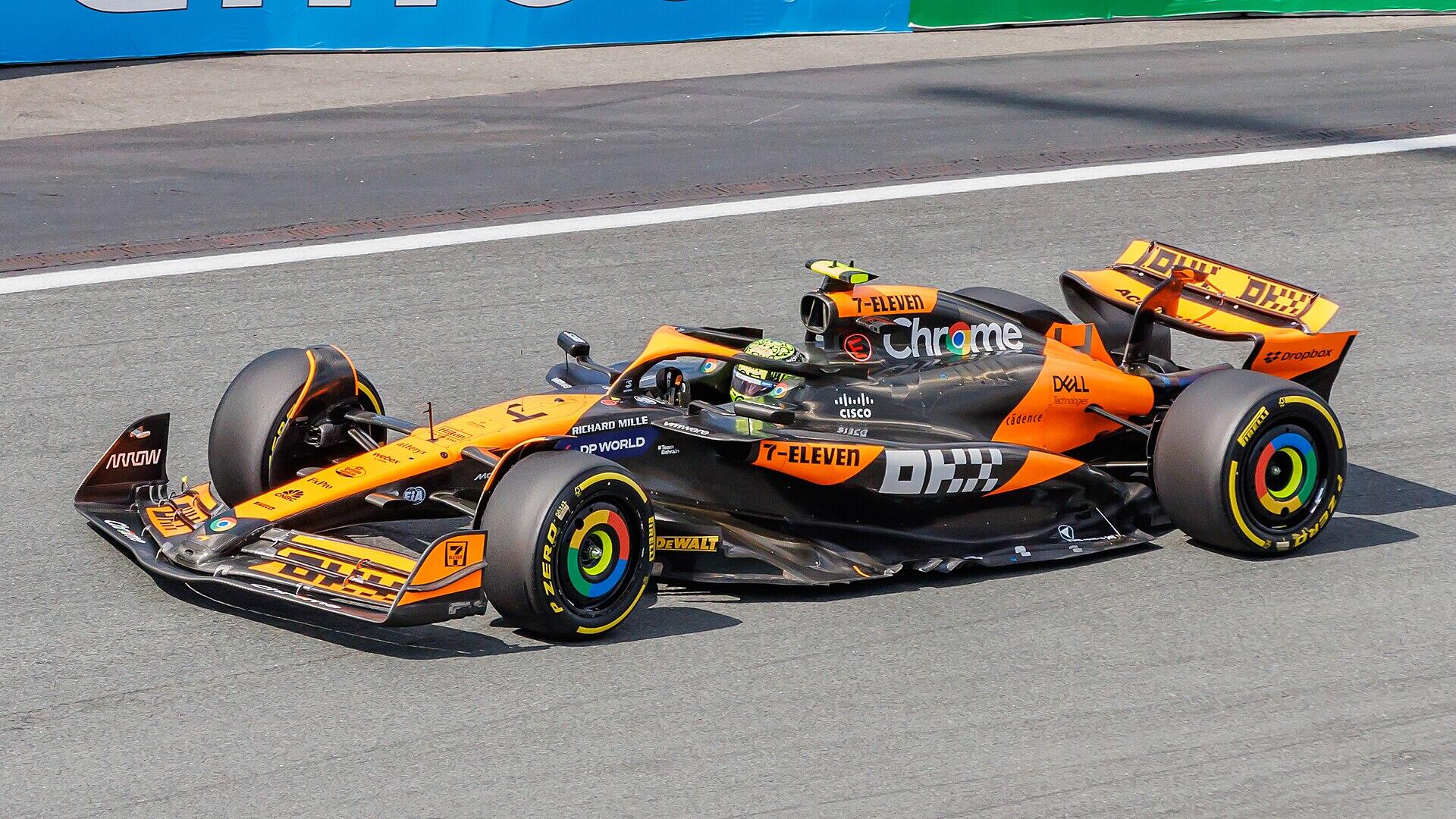 McLaren Formula 1 car in papaya orange livery cornering on track